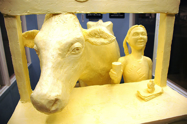 butter food sculpture: cow and girl